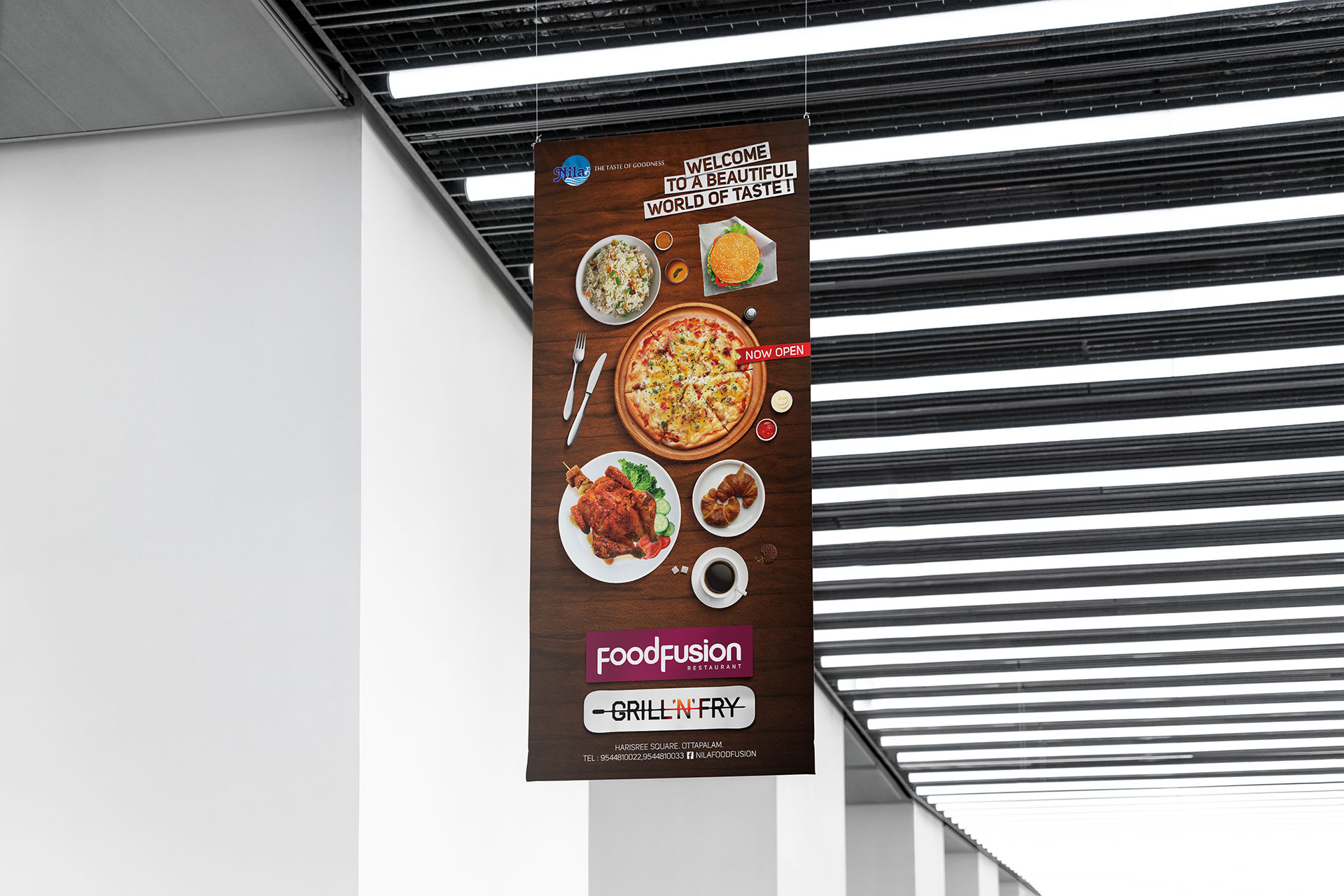 A hanging board of Nila Food Fusion and Grill 'N' Fry Restaurants